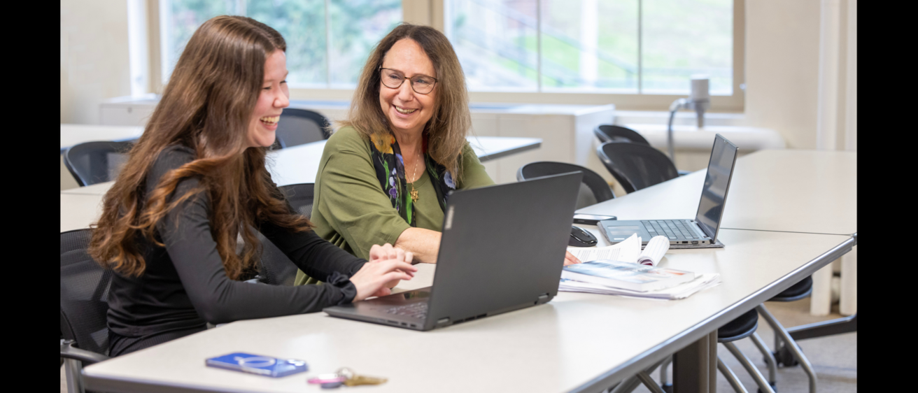 Miriam Landsman with woman looking at a laptop